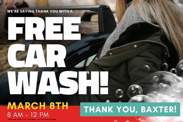 Woman smiling next to clean car. Text reads "We're saying thank you with a Free Car Wash! March 8th 8am-12pm. Thank you, Baxter!" Disclaimer text reads "*Free Basic Wash to all customers. Limit one per customer."