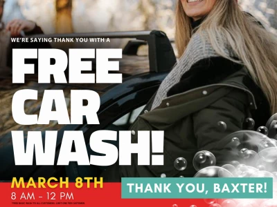 Woman smiling next to clean car. Text reads "We're saying thank you with a Free Car Wash! March 8th 8am-12pm. Thank you, Baxter!" Disclaimer text reads "*Free Basic Wash to all customers. Limit one per customer."
